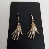 orecchini simboli occulti 