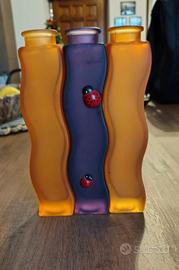 Trio di vasi in vetro.