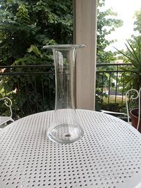 vaso di vetro con piume di pavone