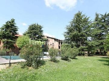 Appartamento bilocale con giardino e piscina