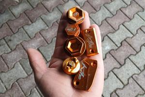 pezzi in ergal e plastice KTM 125-250 