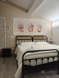 Camere con bagno privato e parcheggio