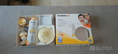 Tiralatte Medela Swing con biberon Calma
