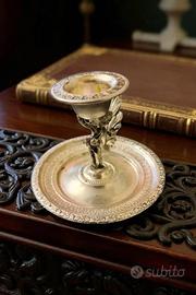 Bugia portacandela con putto in metallo argentato