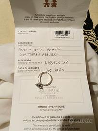 Anello con topazio azzurro oro bianco
