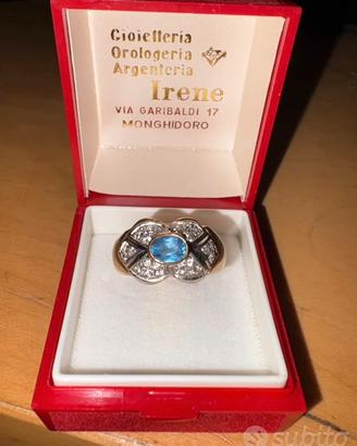anello di oro con pietra e diamanti