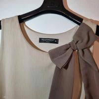 camicetta beige e marrone senza maniche