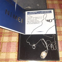 Collana in oro bianco con perla e diamantinj