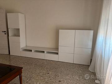 Parete attrezzata e camera da letto