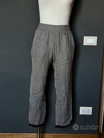 Pantaloni leggeri con pompon neri