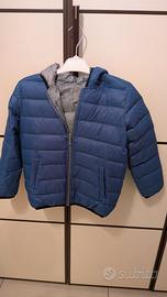 Giubbotto e maglietta aperta 