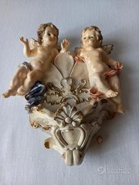 Acquasantiera vintage con due angioletti.