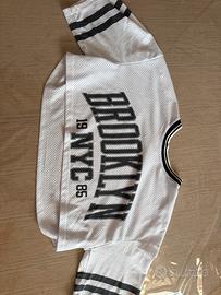 Maglia croppata a rete con scritte