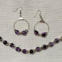 bracciale e orecchini perle viola