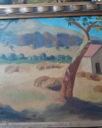 Paesaggio rurale con covoni di grano e casolari