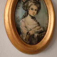 cornice dorata ovale 