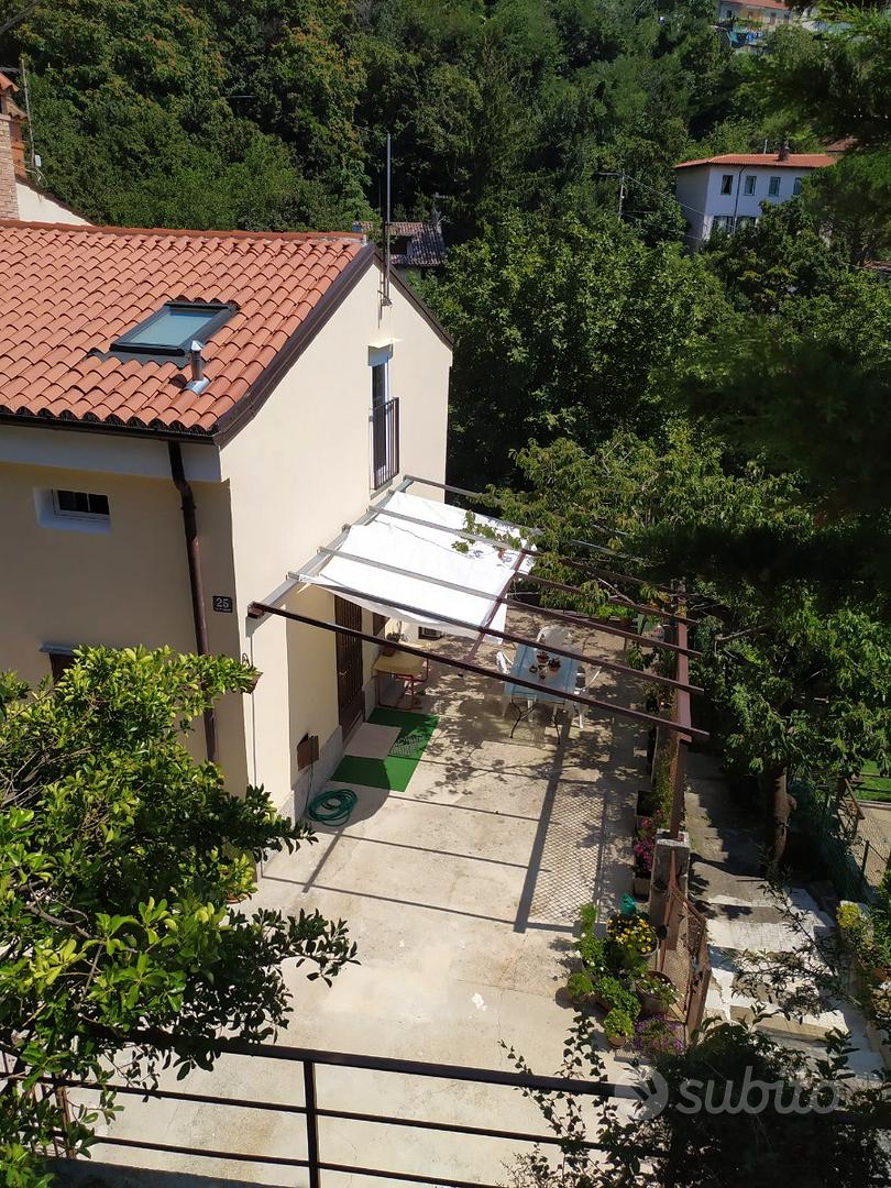 Casa con giardino