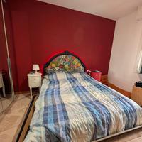 Letto matrimoniale con testiera tropicale 
