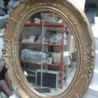Specchiera ovale dorata