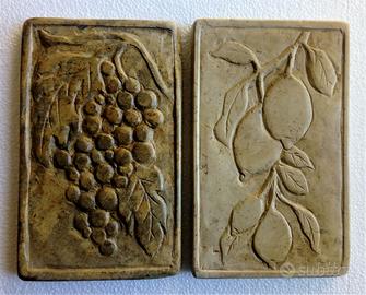 Bassorilievi jn pietra uva e limoni