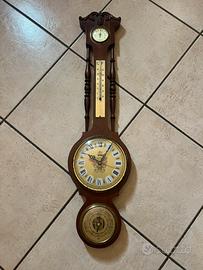 Orologio , con barometro, termometro e misuratore