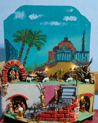Presepe artigianale artistico con sfondo dipinto