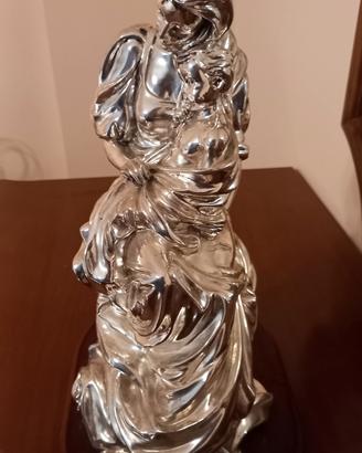 scultura  in resina argentata base in legnoh 32 cm