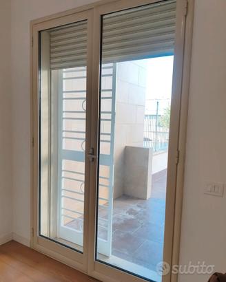 infisso alluminio e inferriata 245*160