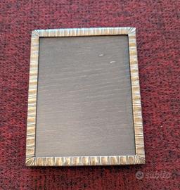 Cornice in argento