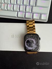 Apple Watch Series 11 46 mm con cinturino dorato