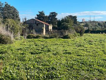 Terreno con caseggiato