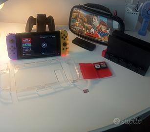 Nintendo Switch 1 + 2 giochi  SD e accessori