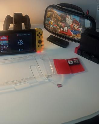Nintendo Switch 1 + 2 giochi  SD e accessori