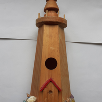 Faro in legno decorato a mano