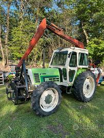 Trattore agrifull con gru forestale