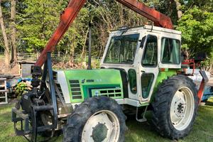 Trattore agrifull con gru forestale