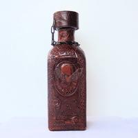 BOTTIGLIA con CERVANTES, foderata in cuoio