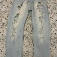 Jeans skinny strappati blu