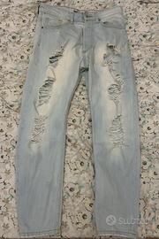 Jeans skinny strappati blu