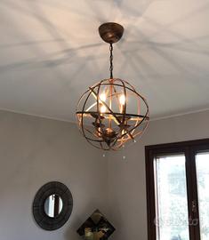 Lampadario e applique in ferro brunito