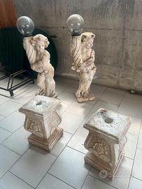coppia statue lampioni da giardino putti con basi 