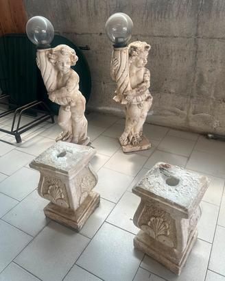 coppia statue lampioni da giardino putti con basi 