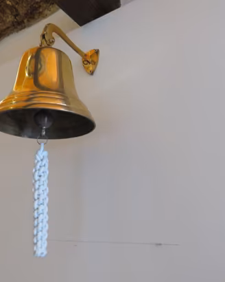 Campana oscillante in ottone lucido