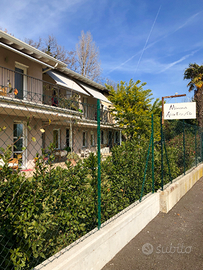 Trilocale con giardino e piscina