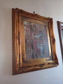 Quadro con cornice dorata intagliata