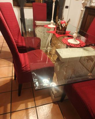 Tavolo in cristallo con basi in travertino 