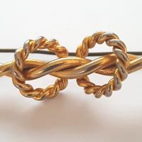 Antica Spilla dorata con Nodo intrecciato anni ’50