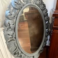 Specchio decorativo ovale con cornice lavorata
