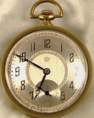 Orologio da tasca " Art Decò " in ottone e rame.