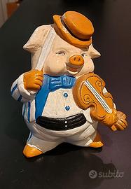 Porcellino violinista salvadanaio in terracotta.